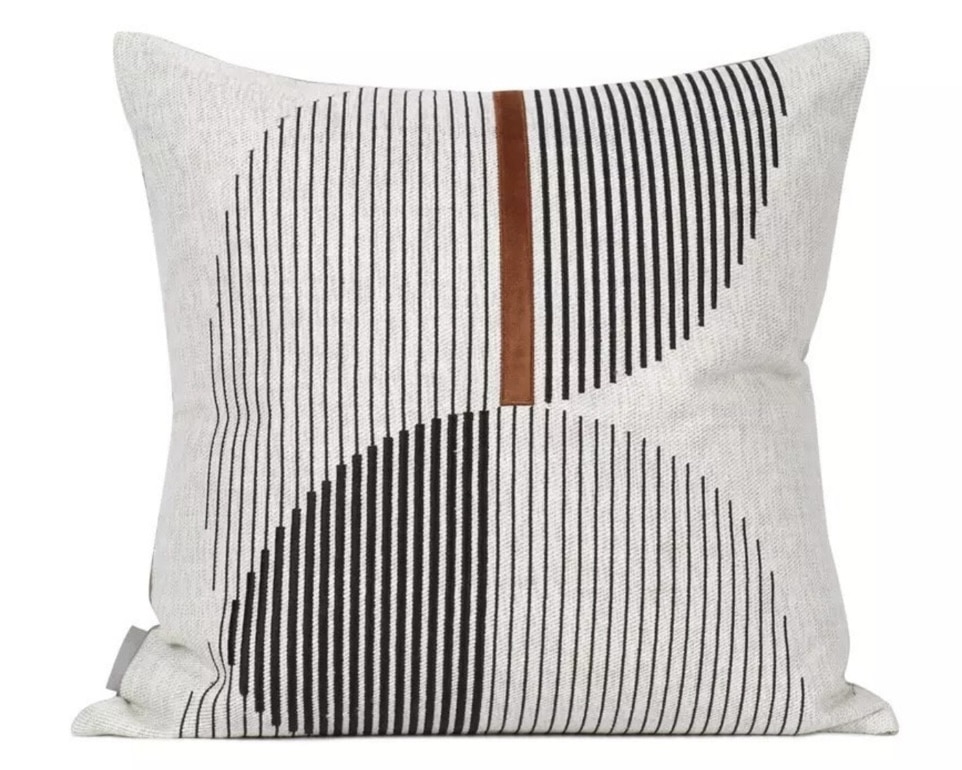 Beige geometric cushion with curved line motif — calm and modern