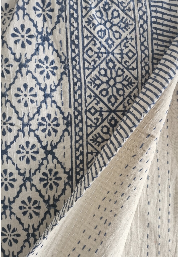 Chic boho bedroom throw: reversible kantha stitch cotton throw in soft neutrals with indigo pattern.