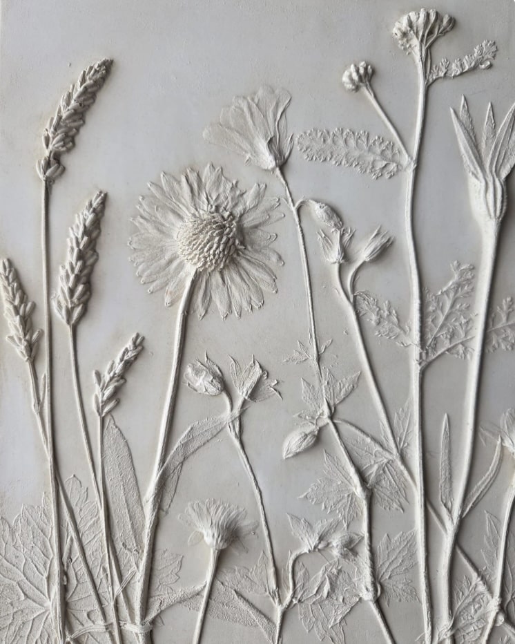 Chic boho bedroom wall decor: raised plaster botanical cast tile artwork in soft white.