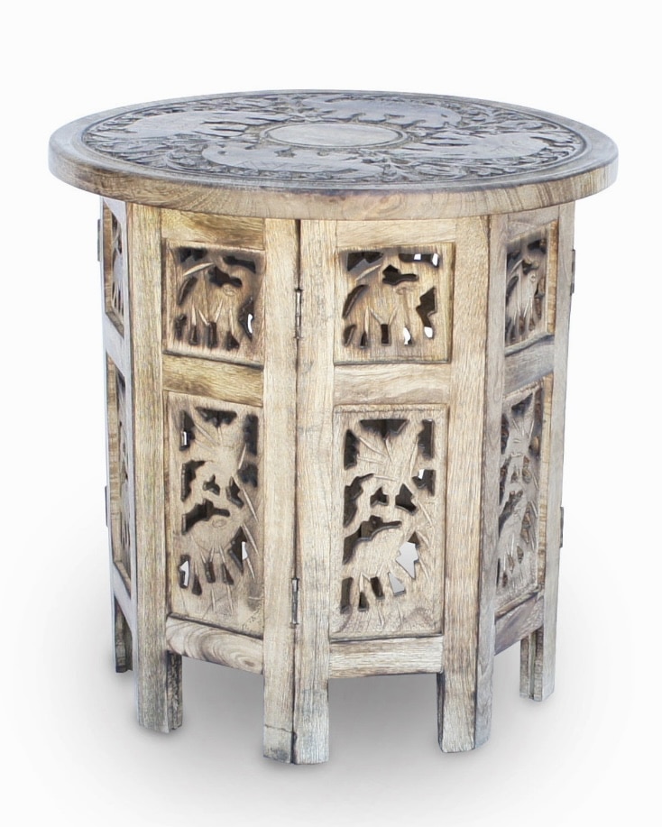 Chic boho bedroom bedside idea: carved mango wood octagonal side table with elephant motifs.