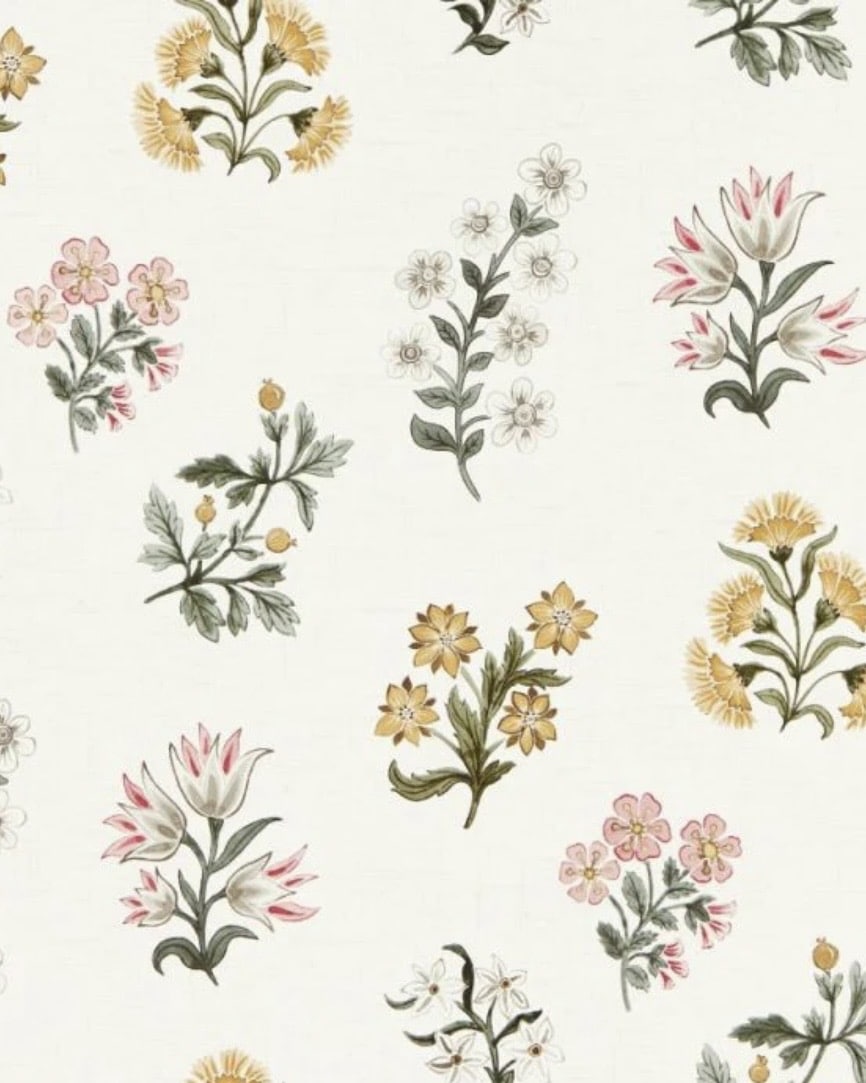 Botanical scatter wallpaper with blush and ochre flowers on a pale background