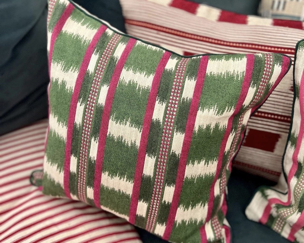 Handmade piped cushions in green and pink stripe for a country cottage bedroom