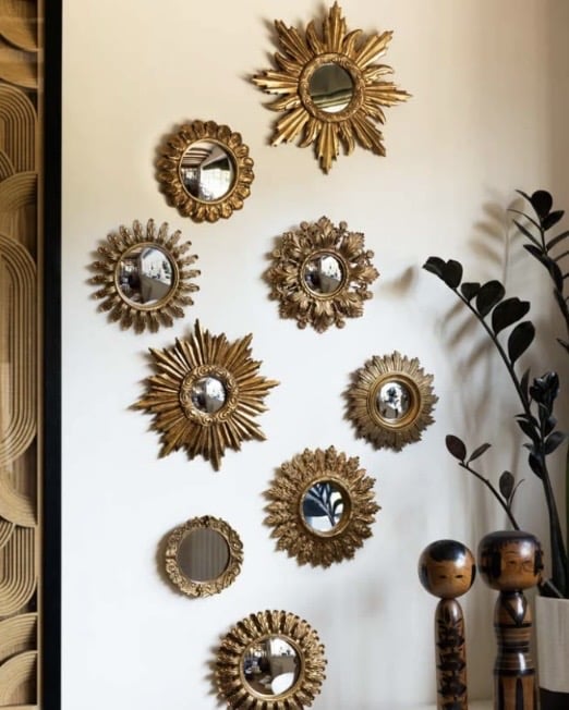 Set of assorted ornate gold framed mirrors for a neutral bathroom