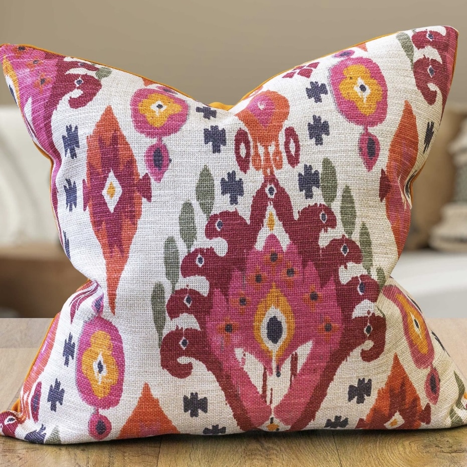 Bright pink and orange ikat cushion