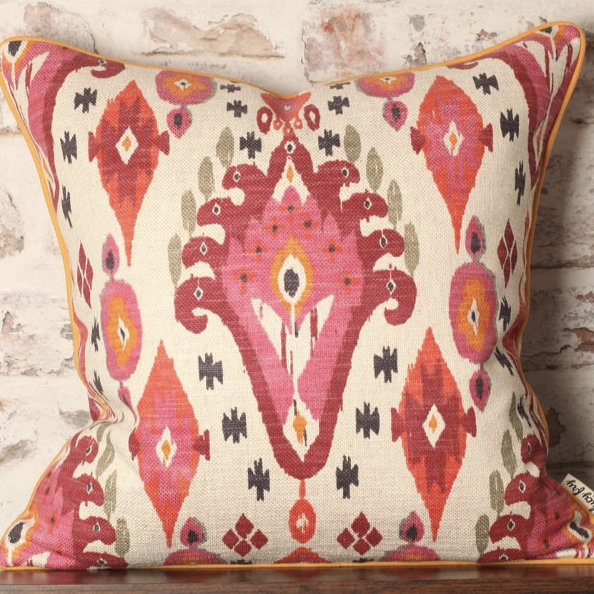Ikat cushion in pink, orange and cream