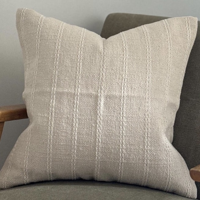 Cream stripe cushion in a soft cotton weave