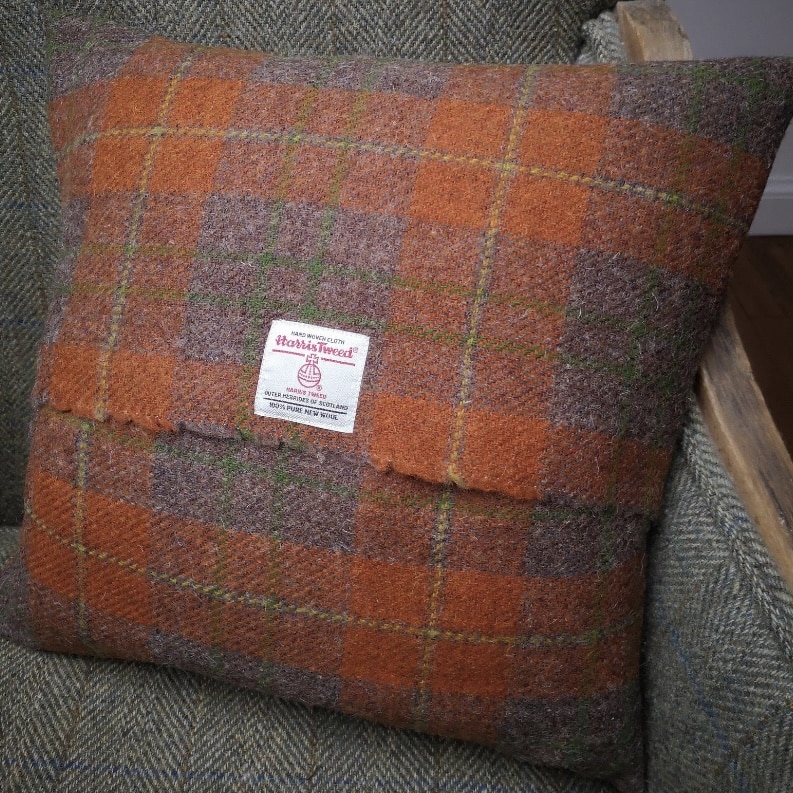 Harris tweed cushion in a warm orange check pattern