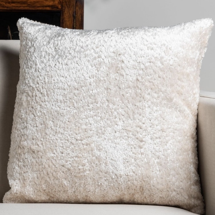 Cream boucle cushion for soft, cosy texture