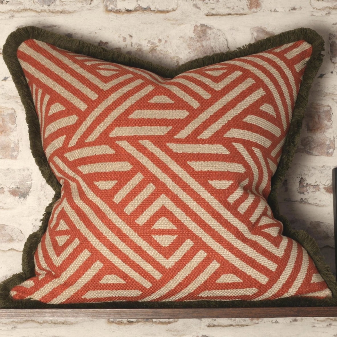 Terracotta geometric cushion cover with olive trim (shop the look pick)