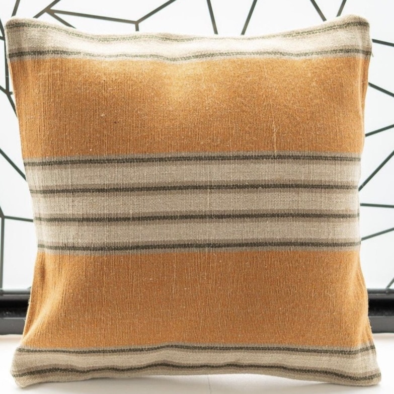 Orange striped cushion with warm ochre and neutral bands
