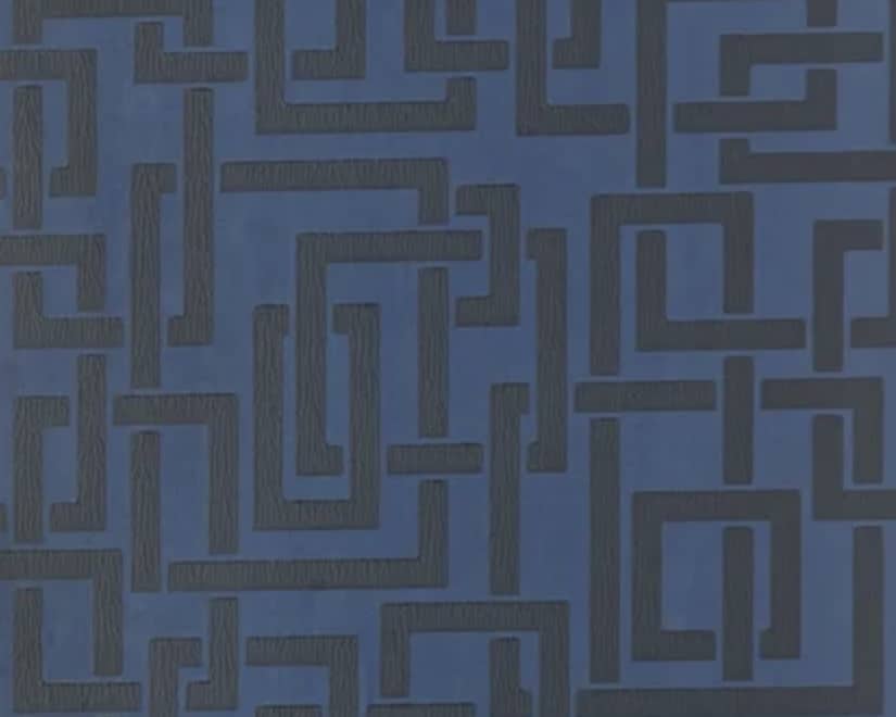 Blue geometric wallpaper to introduce pattern into an orange and blue living room