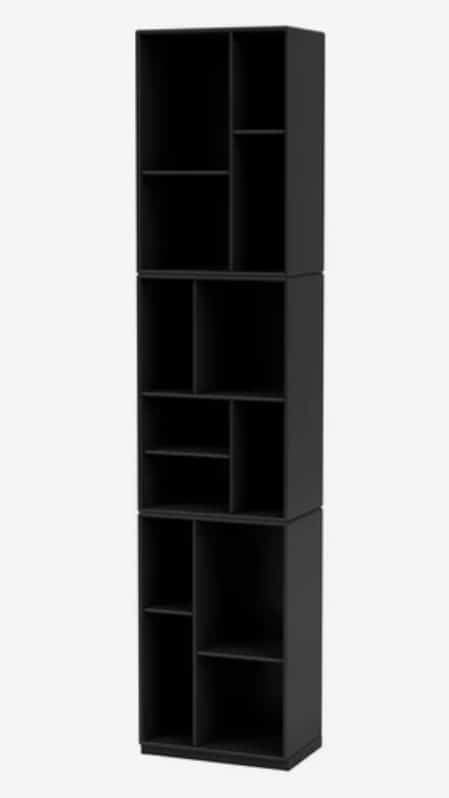 Tall slim black bookcase for vertical storage in a small living room