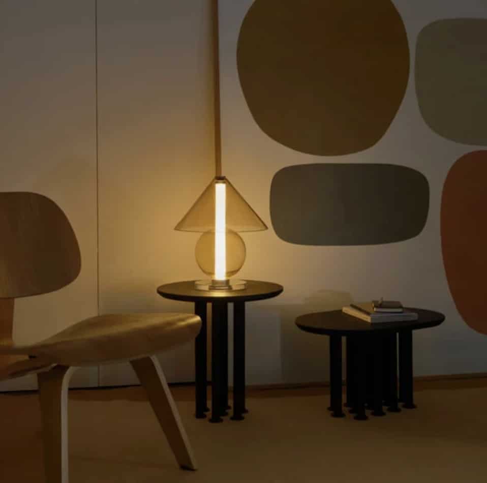 Task lighting for living room: warm table lamp glow creating a cosy reading corner.