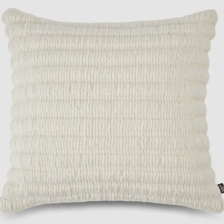 Tom Dixon Ridge cushion in Natural — ribbed texture lumbar for a tan leather sofa