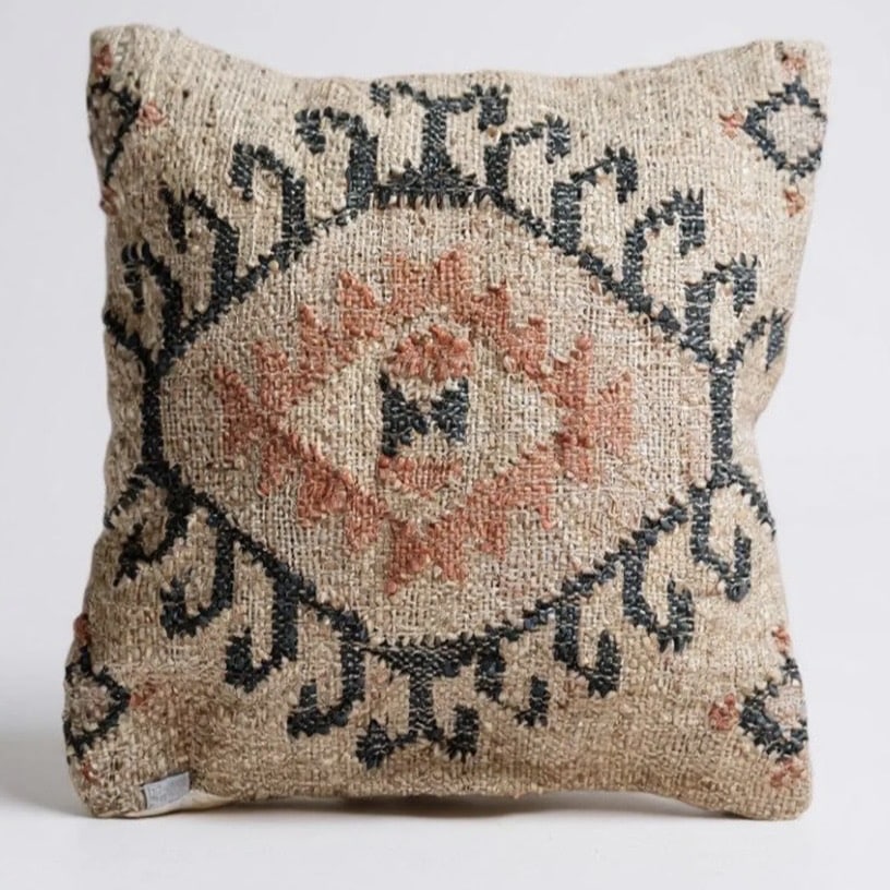 Tan leather sofa cushions — jute kilim cushion with rust and charcoal geometric pattern