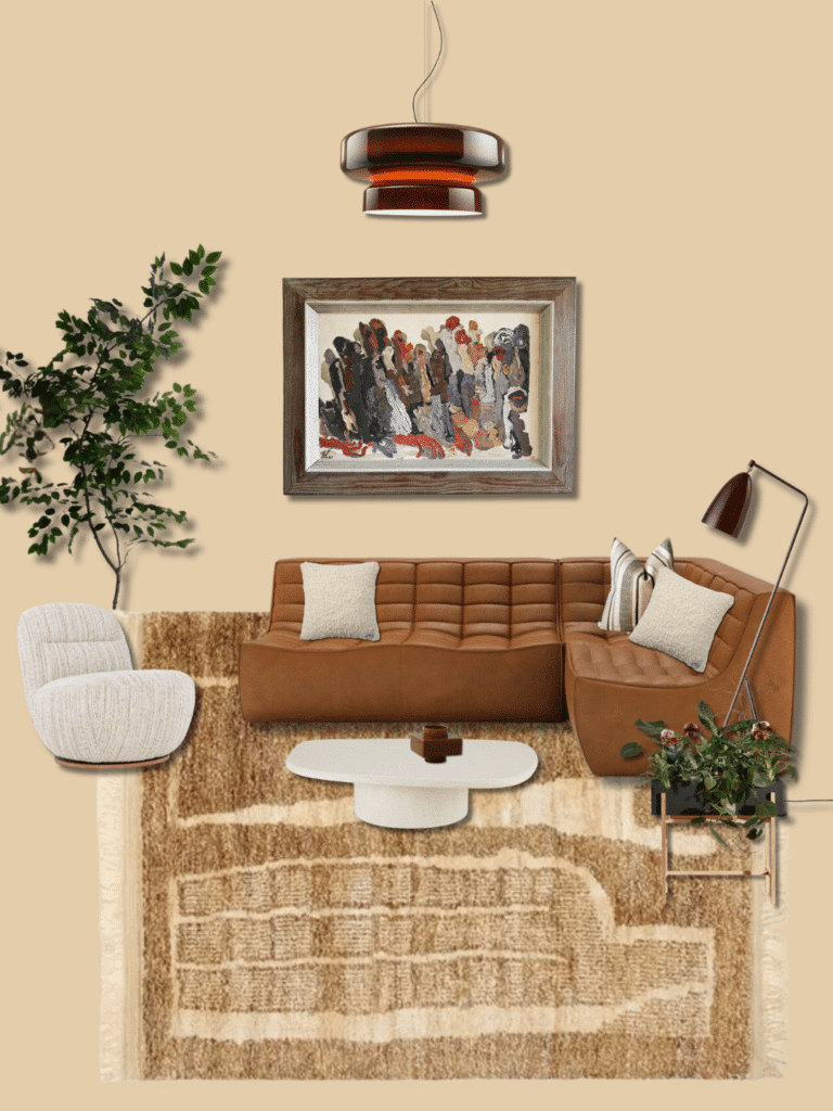 Tan leather sofa living room ideas — calm neutrals with jute rug, boucle chair, amber pendant and vintage art on warm beige walls.