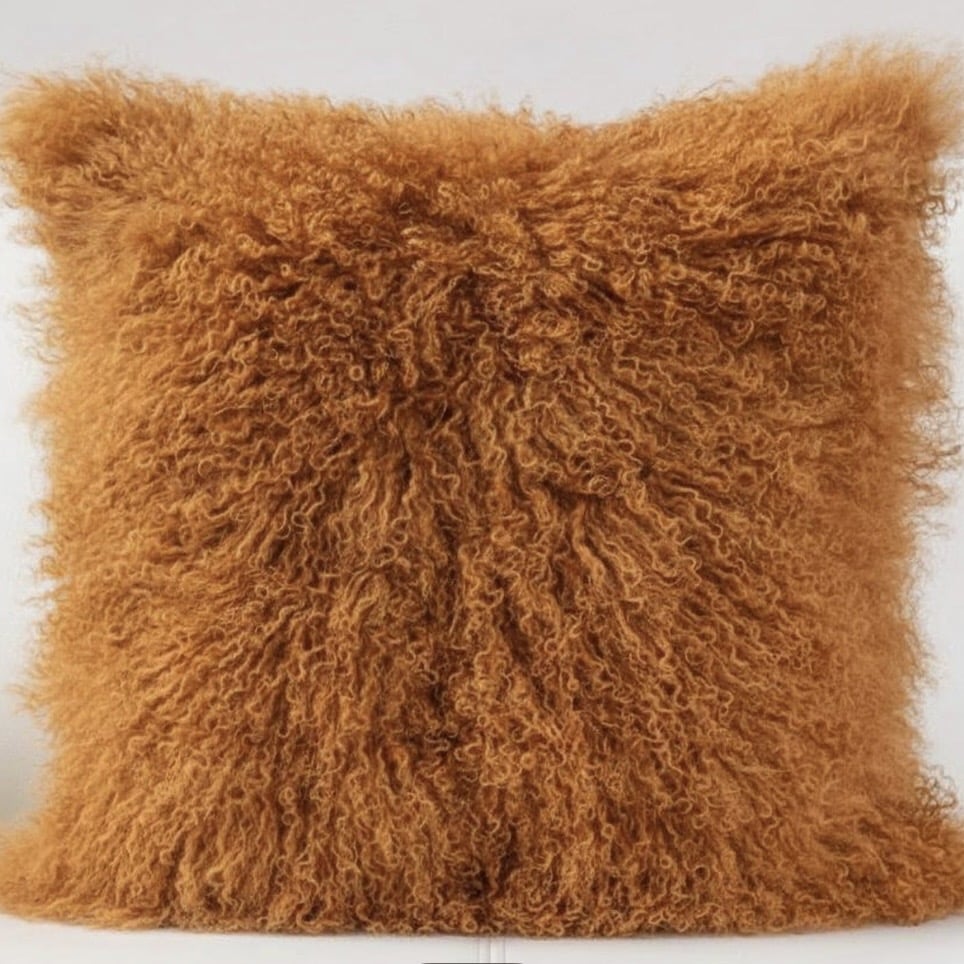 Tan leather sofa cushions — burnt orange Mongolian sheepskin cushion for cosy texture