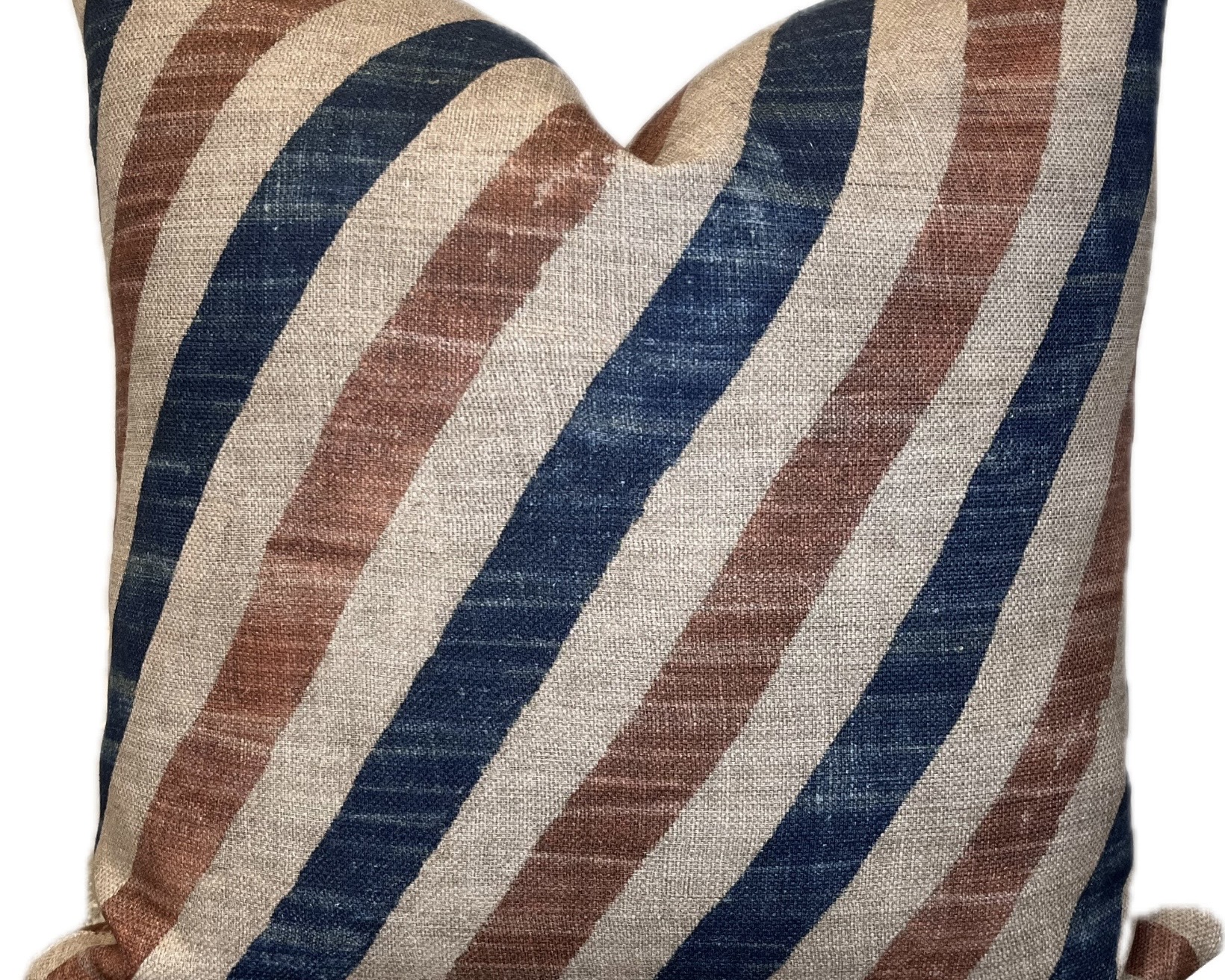 Striped cushion in navy, caramel and natural linen tones tie in with the tan leather sofa living room