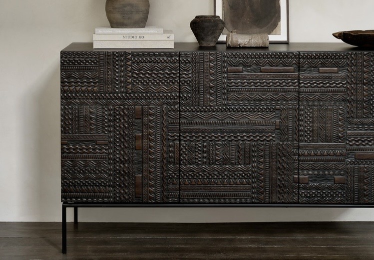 Dark carved sideboard to ground tan leather sofa and blue-grey tones