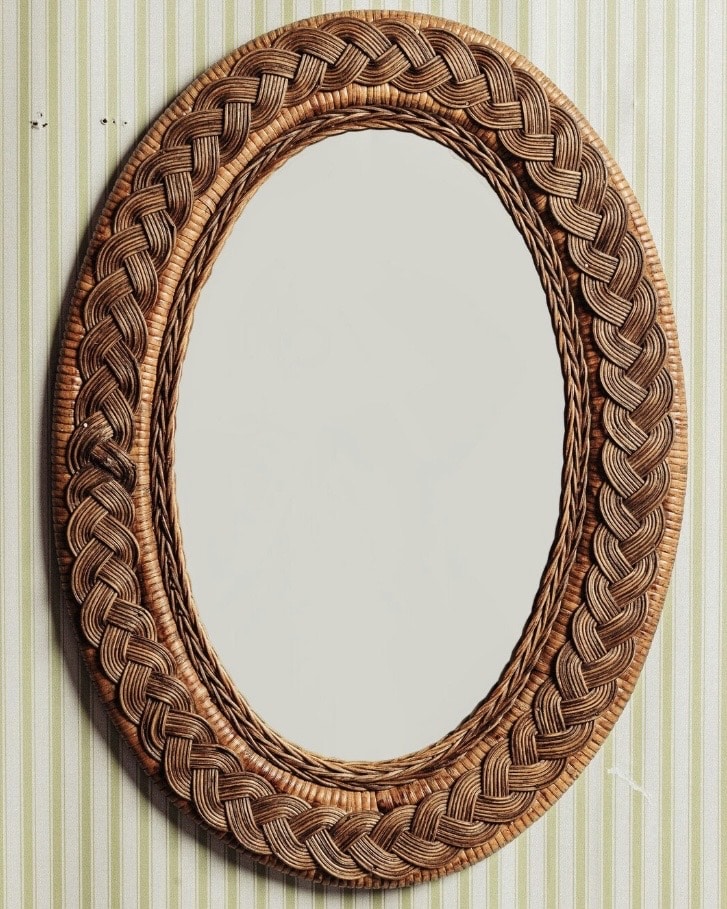 Rattan oval mirror in natural teak tone adds cottage charm to a neutral bathroom