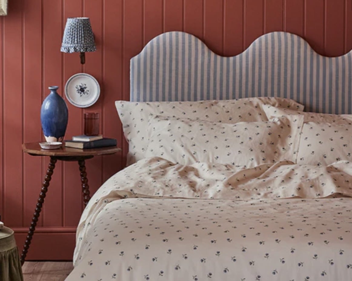 Piglet in Bed children’s bedding in a cosy bedroom with a scalloped headboard