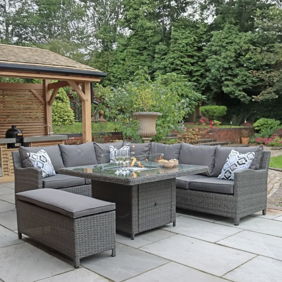 Outdoor corner sofa dining set with integrated fire pit table — rattan garden corner sofa for evening lounging