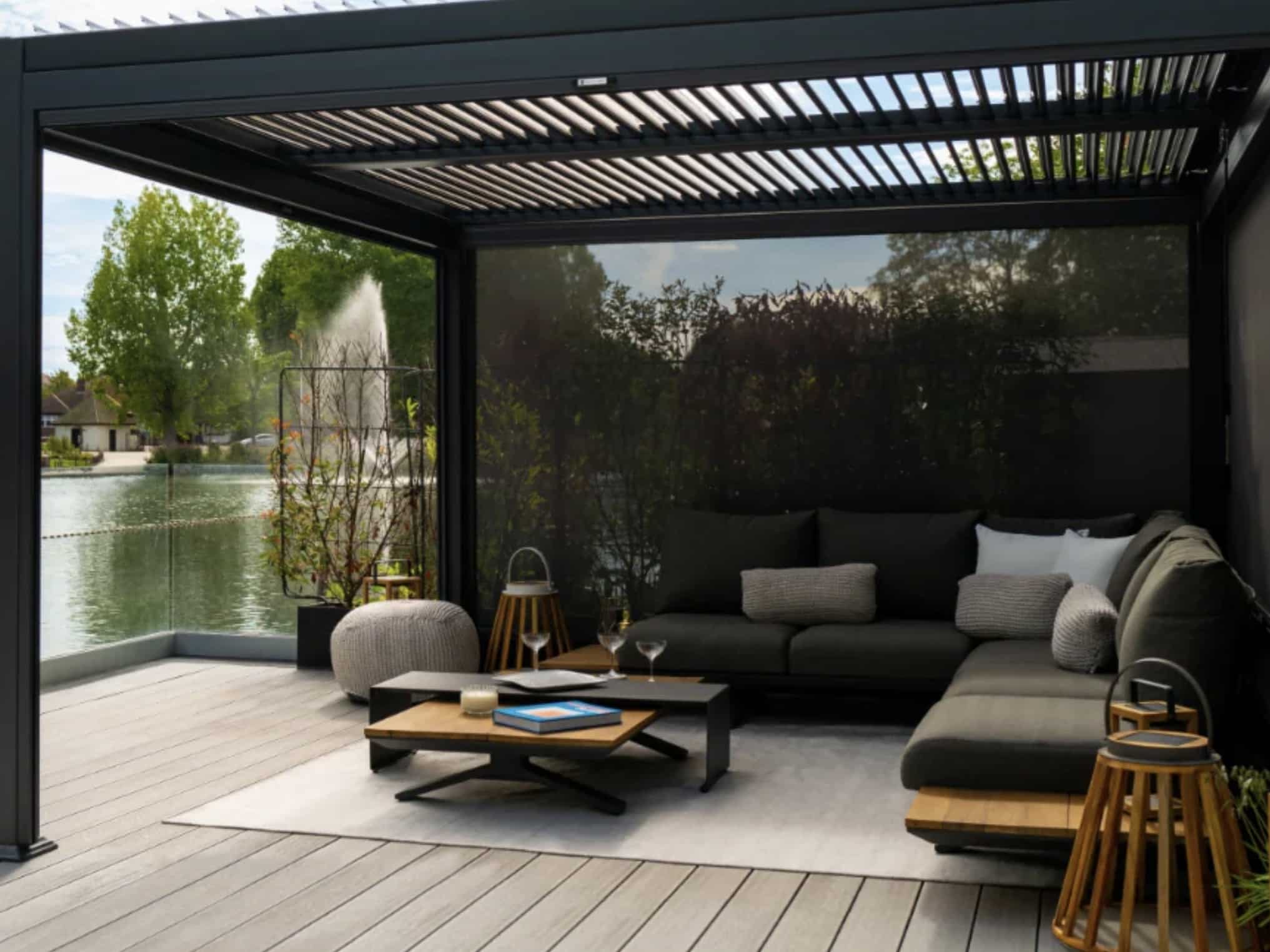 louvred pergola with corner garden sofa and mesh side blinds — outdoor corner sofa under pergola, UK