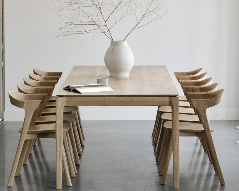 Ethnicraft extendable oak dining table in a modern dining room setting
