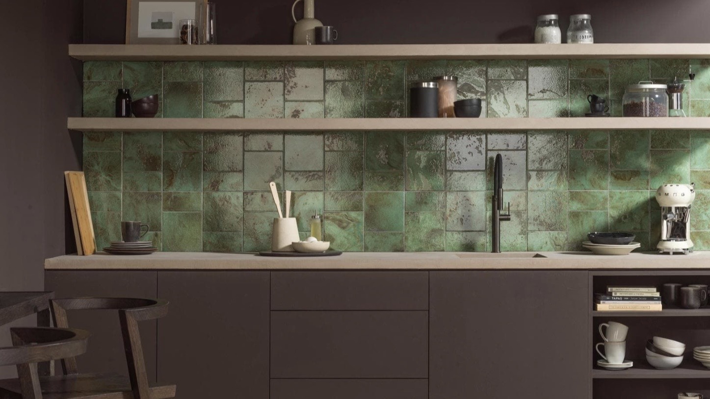 Green glazed Porcelanosa kitchen tiles styled as a statement splashback
