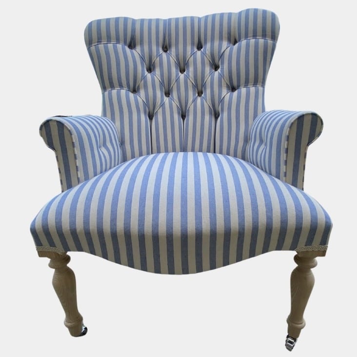 Blue and white striped accent chair with button back and pale wooden legs