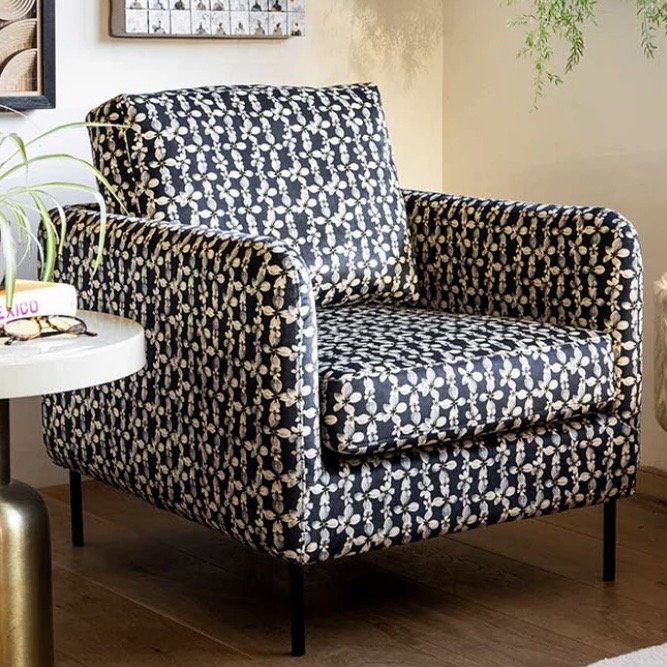 The Edie Daisy Print Velvet Armchair with black floral upholstery