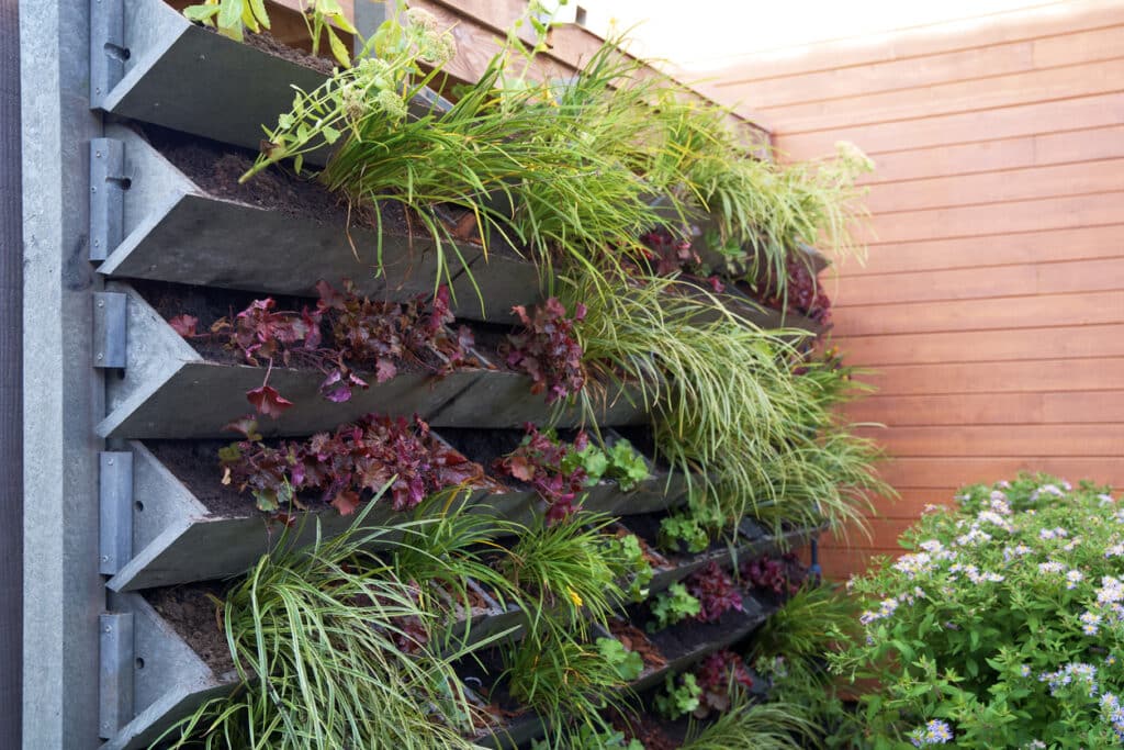 Small garden ideas UK: vertical garden living wall to maximise space in a small courtyard garden