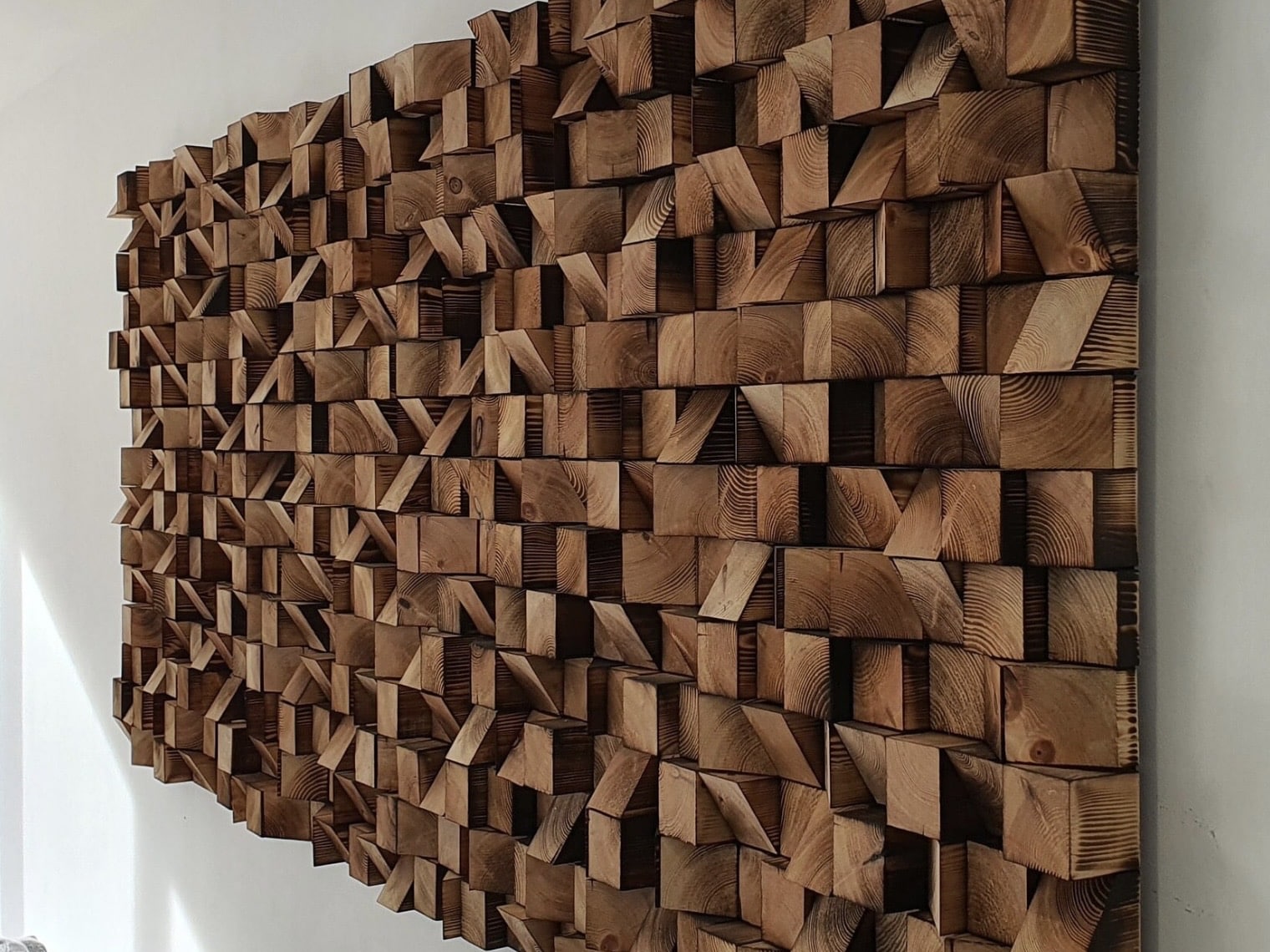 Sculptural wooden wall art panel with a 3D cube texture