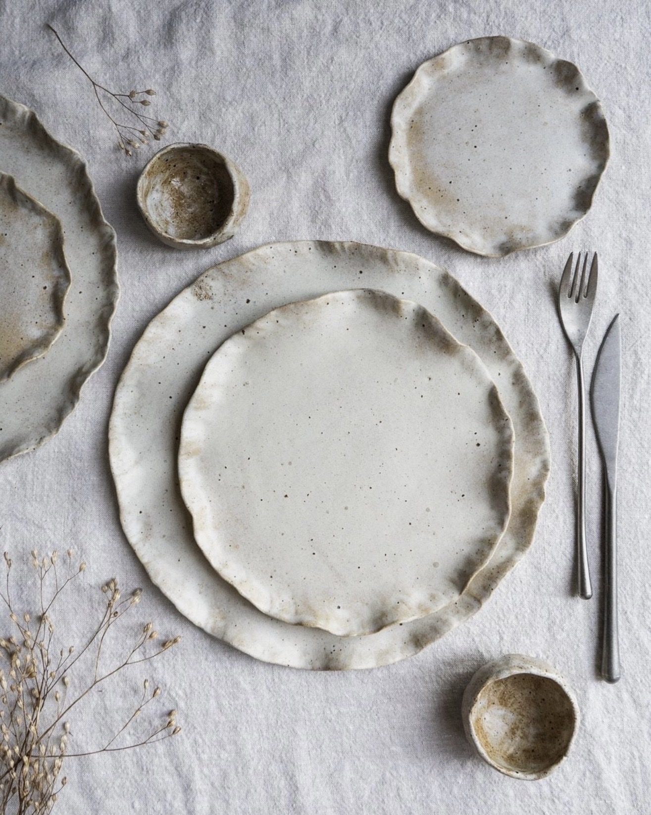 Organic stoneware plates and bowls by EveryStoryStudio