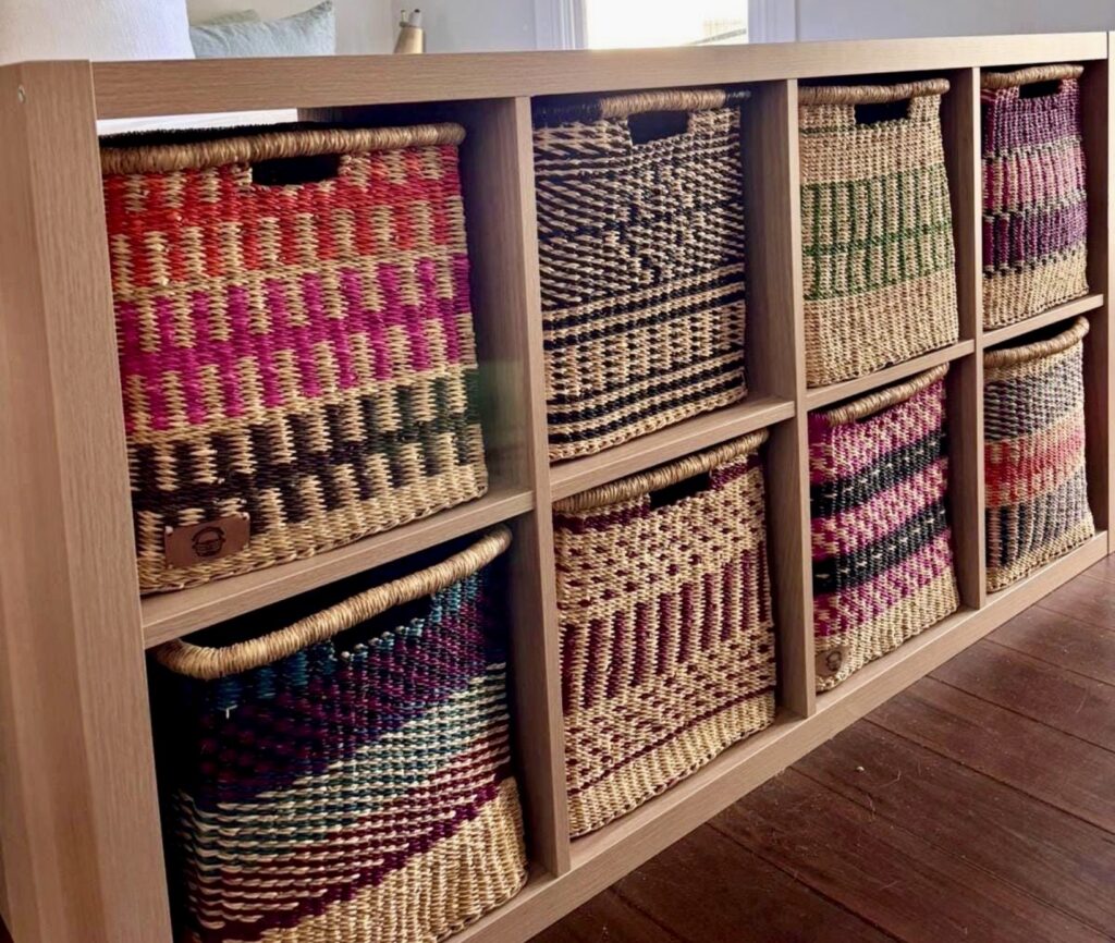 Handwoven Bolga baskets for IKEA Kallax cube storage unit, living room storage ideas with woven baskets