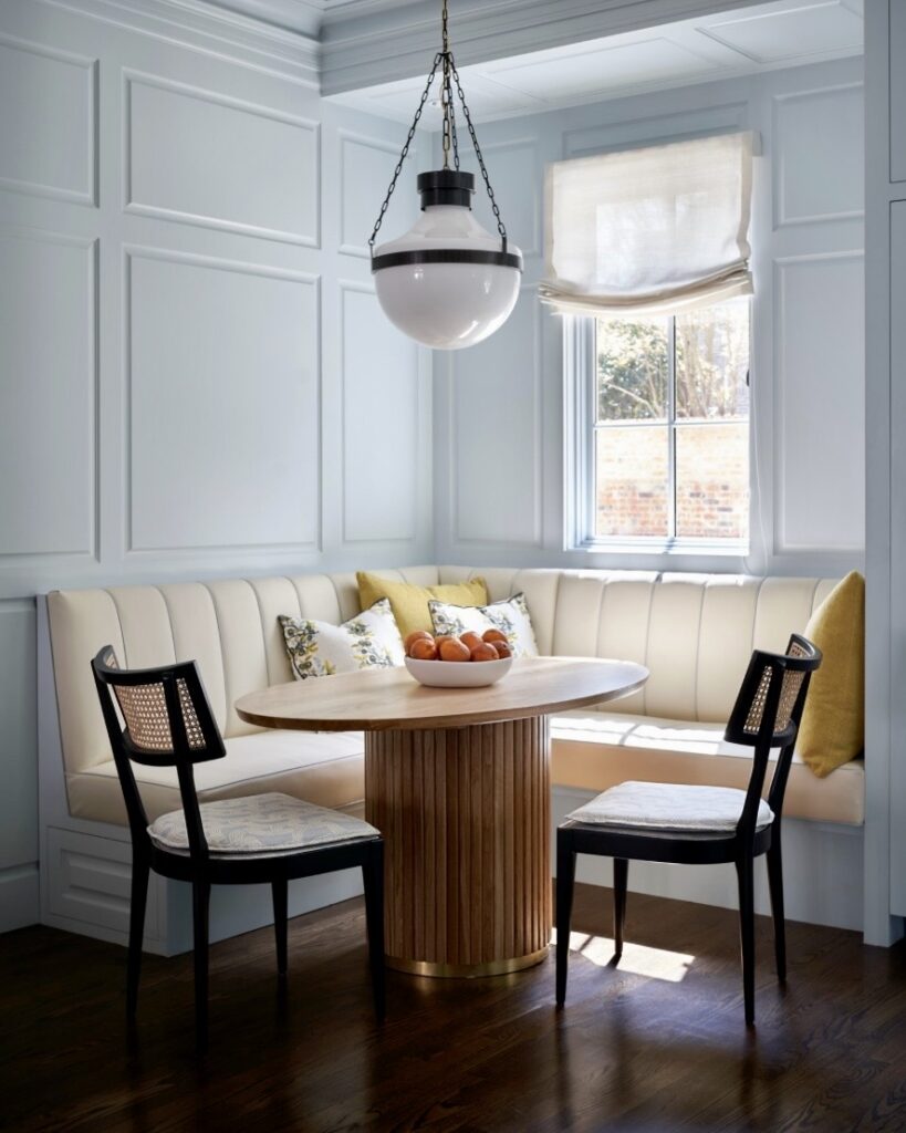 blue dining room colour ideas with borrowed light walls round dining table globe pendant and built in banquette seating