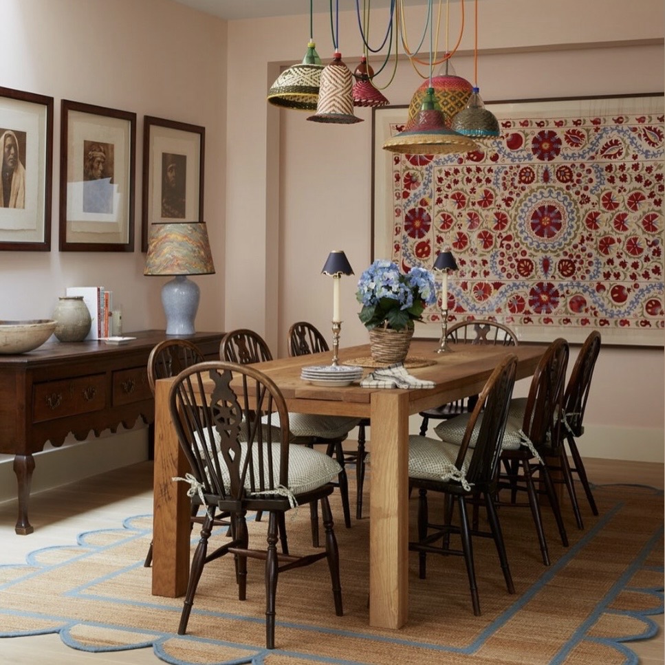 blush dining room colour ideas with soft pink walls colourful pendant lighting and wooden dining table