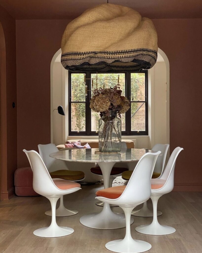 blush dining room colour ideas with fox red farrow and ball walls round dining table and modern white chairs