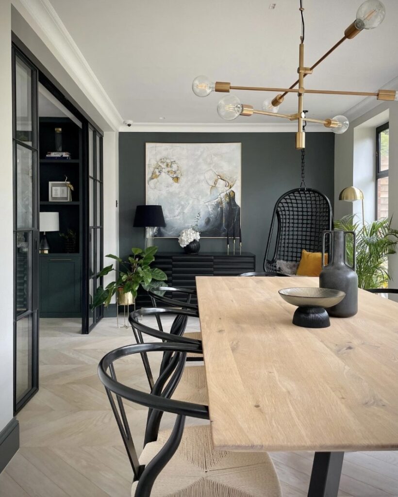 dark dining room colour ideas with down pipe farrow and ball walls wood dining table and brass lighting