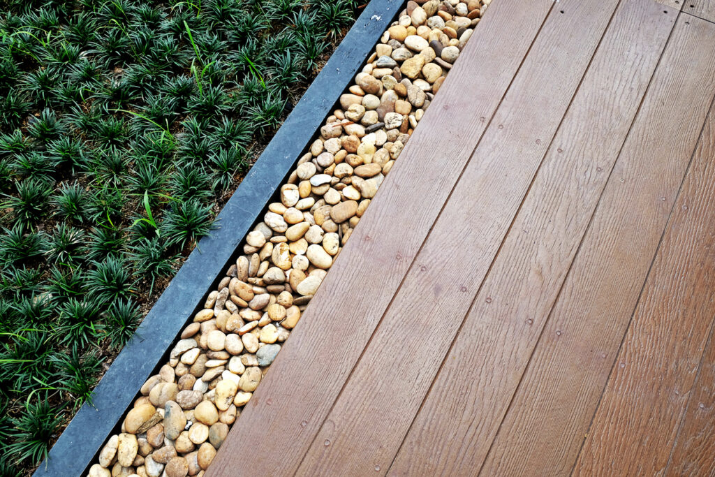 mixed material garden edging with timber gravel and paving for modern garden layout