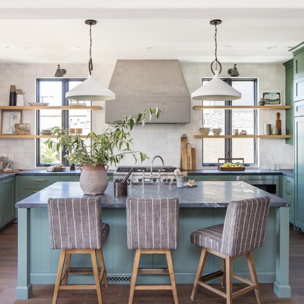 Kitchen dining room ideas with Green Smoke cabinetry, a freestanding-style island, floating wooden shelves and white pendant lighting