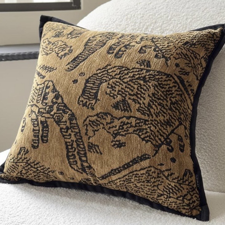 Tan and black textured accent cushion for a beige and black bedroom