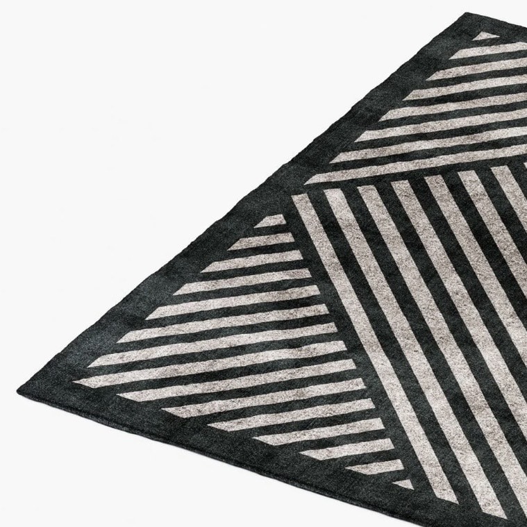 Black and beige geometric rug for a modern beige and black bedroom
