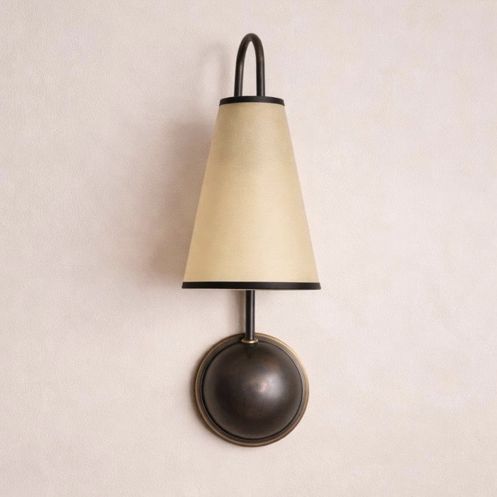Single arm fabric shade wall sconce in brass finish