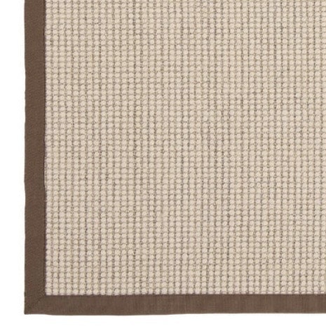 Sisal boucle mocha rug in a luxury beige bedroom