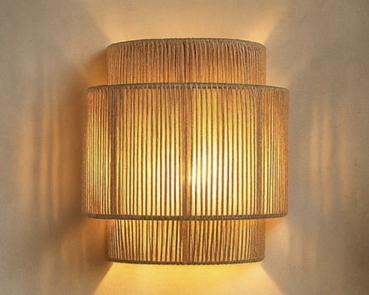 Handwoven rattan wall light for warm beige bedroom lighting