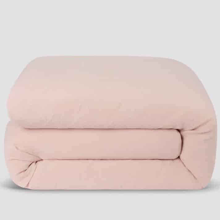 Poetic pink washed cotton bedding in a pink and green bedroom