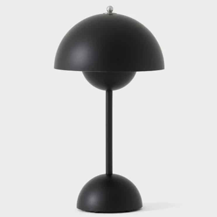 Matt black portable table lamp for a pink and green living room