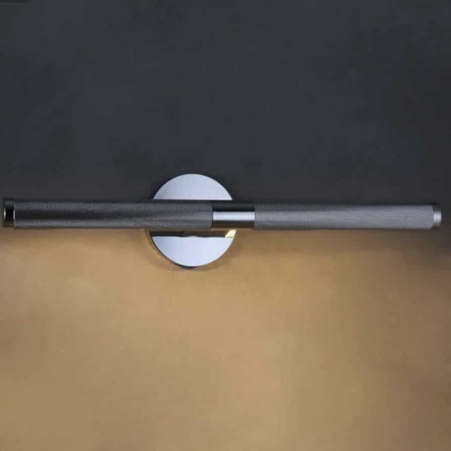 Bronze picture wall light for a pink and green living room