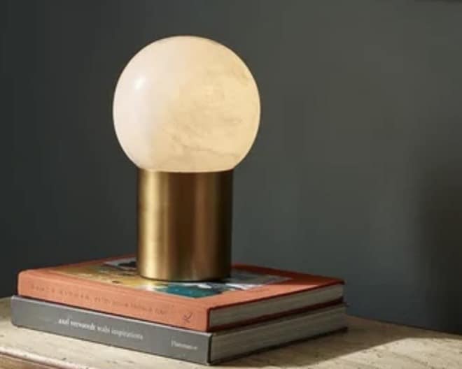 Marble globe table lamp for a pink and green living room
